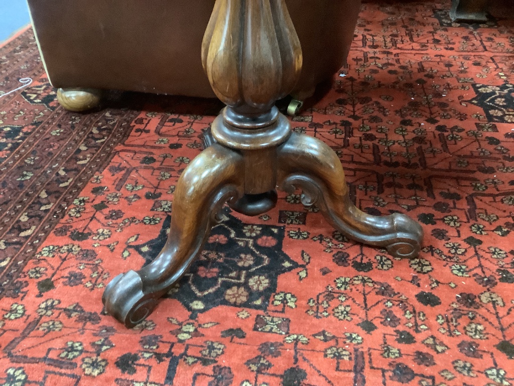 A Victorian rosewood rectangular tripod table, width 49cm, depth 39cm, height 75cm